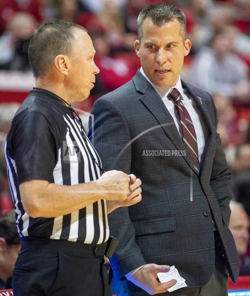 Rich Janzaruk Troy coach Scott Cross talks with an official during the team's NCAA college basketball game against Indiana on Saturday, Nov. 16, 2019, in Bloomington, Ind. (Rich Janzaruk/The Herald-Times via AP