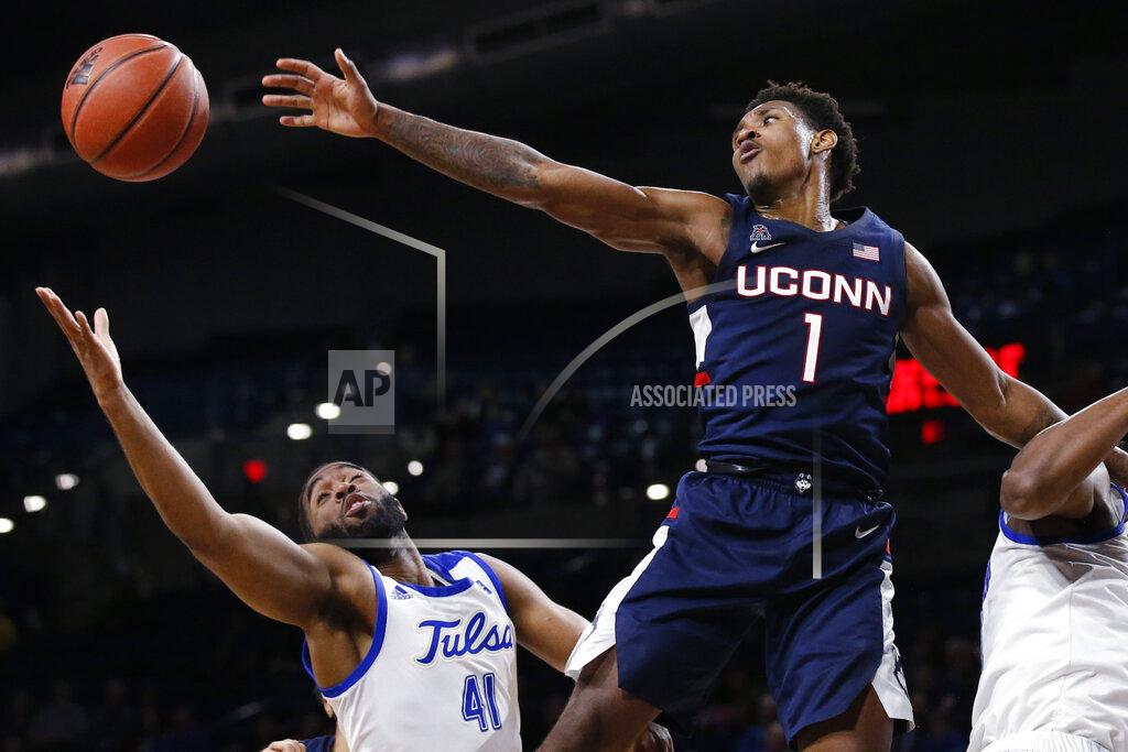 Sue Ogrocki Connecticut guard Christian Vital (1) and Tulsa forward Jeriah Horne (41) reach for the ball during the second half of an NCAA college basketball game in Tulsa, Okla., Thursday, Feb. 6, 2020. (AP Photo/Sue Ogrocki)