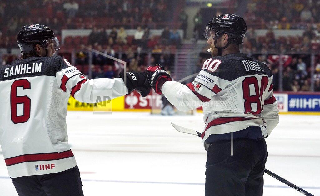 Martin Meissner Canada's Pierre-Luc Dubois, right, celebrates after scoring his side's second goal during the group A Hockey World Championship match between Germany and Canada in Helsinki, Finland, Friday May 13, 2022. (AP Photo/Martin Meissner)