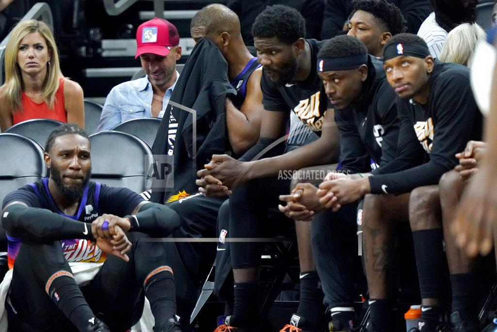 Matt York Phoenix Suns players watch from the bench during the second half of Game 7 of an NBA basketball Western Conference playoff semifinal against the Dallas Mavericks, Sunday, May 15, 2022, in Phoenix. The Mavericks defeated the Suns 123-90. (AP Photo/Matt York)
