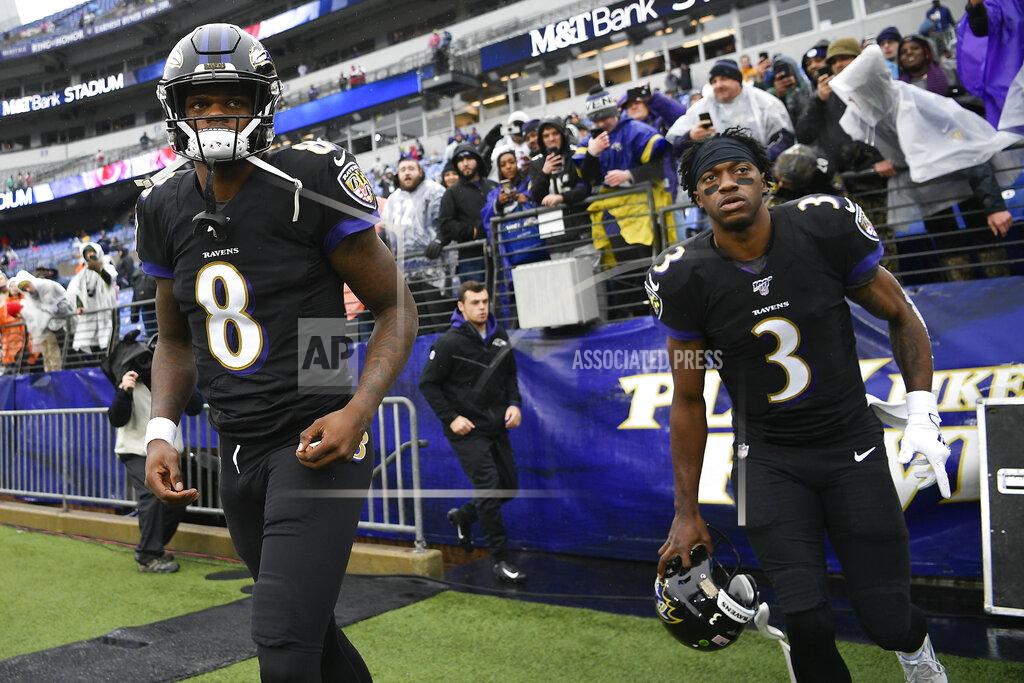 Nick Wass Baltimore Ravens quarterbacks Lamar Jackson, left, and Robert Griffin III, right, take the field to begin warming up before the start of an NFL football game against the San Francisco 49ers, Sunday, Dec. 1, 2019, in Baltimore, Md. (AP Photo/Nick Wass)