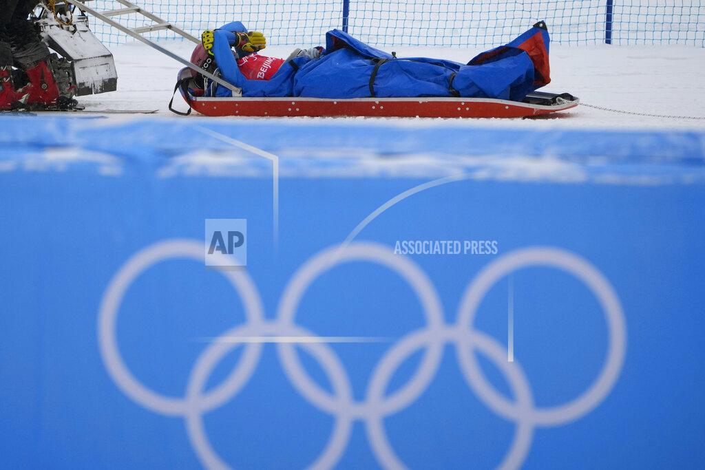 Aaron Favila Italy's Lucrezia Fantelli reacts as she is carried away by officials after an injury during the women's cross finals at the 2022 Winter Olympics, Thursday, Feb. 17, 2022, in Zhangjiakou, China. (AP Photo/Aaron Favila)