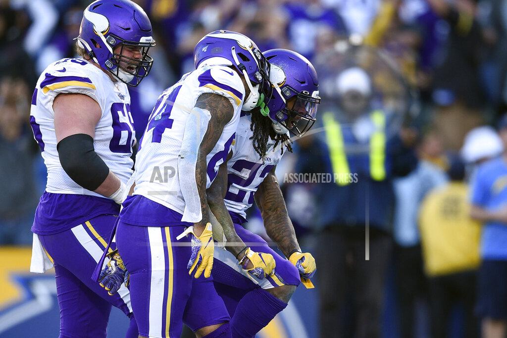 Kelvin Kuo Minnesota Vikings running back Mike Boone, right, reacts with teammates after scoring a touchdown during the second half of an NFL football game against the Los Angeles Chargers, Sunday, Dec. 15, 2019, in Carson, Calif. (AP Photo/Kelvin Kuo)