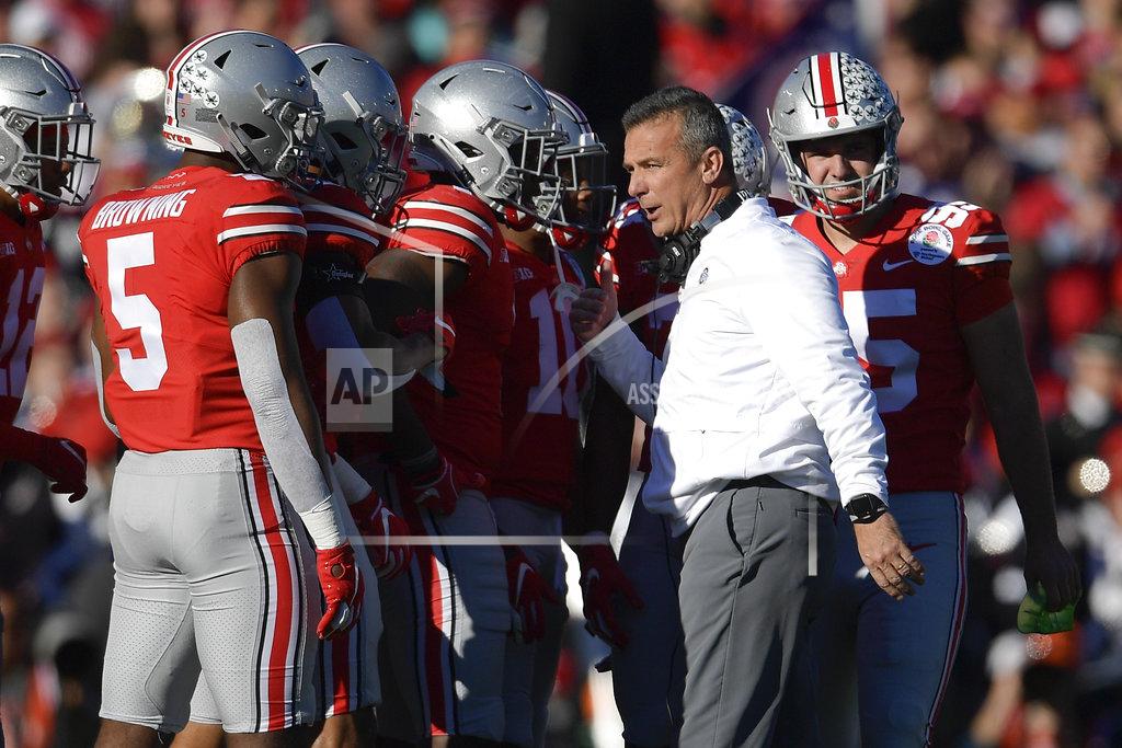 Mark J. Terrill Ohio State head coach Urban Meyer talks with his team during the first half of the Rose Bowl NCAA college football game Washington Tuesday, Jan. 1, 2019, in Pasadena, Calif. (AP Photo/Mark J. Terrill)