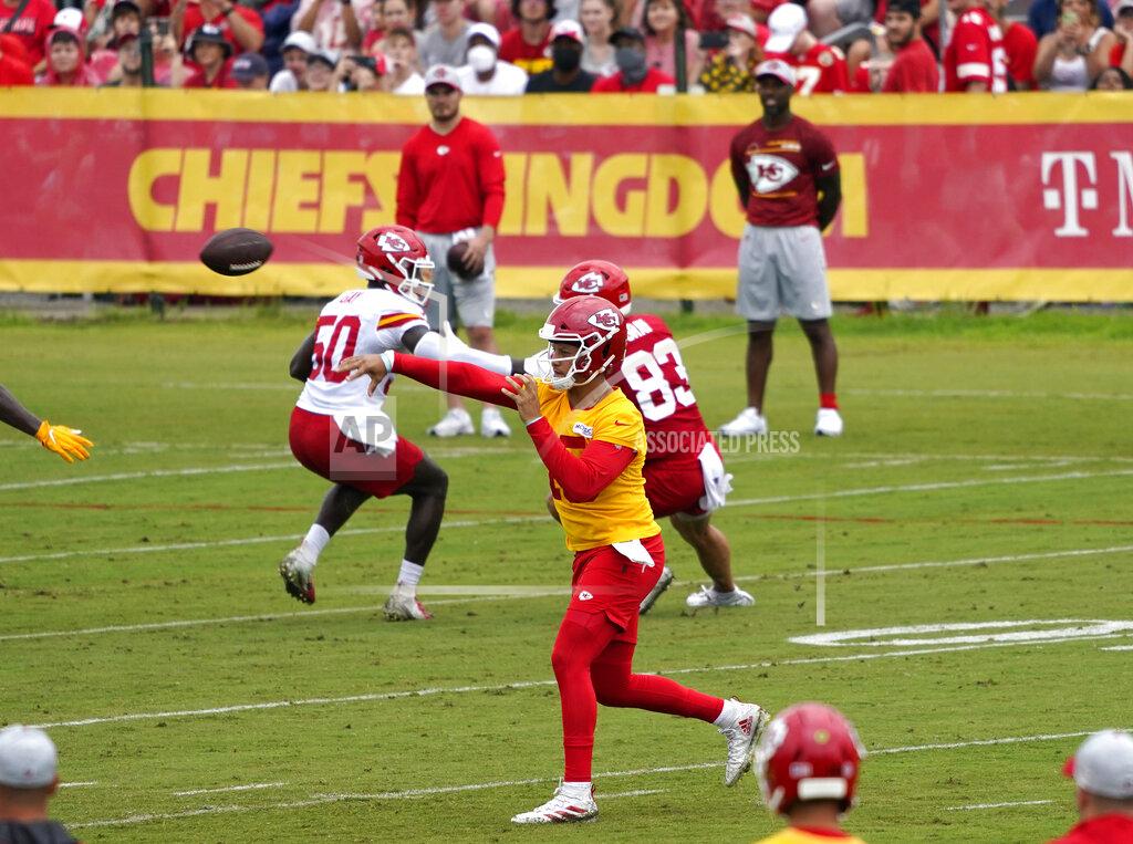 Ed Zurga Kansas City Chiefs quarterback Patrick Mahomes, front, passes the ball during drills at the team's NFL football training camp Saturday, July 31, 2021, in St. Joseph, Mo. (AP Photo/Ed Zurga)