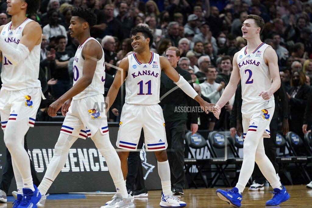 Nam Y. Huh Kansas' Remy Martin and Christian Braun celebrate after the second half of a college basketball game in the Sweet 16 round of the NCAA tournament against Providence Friday, March 25, 2022, in Chicago. Kansas won 66-61. (AP Photo/Nam Y. Huh)
