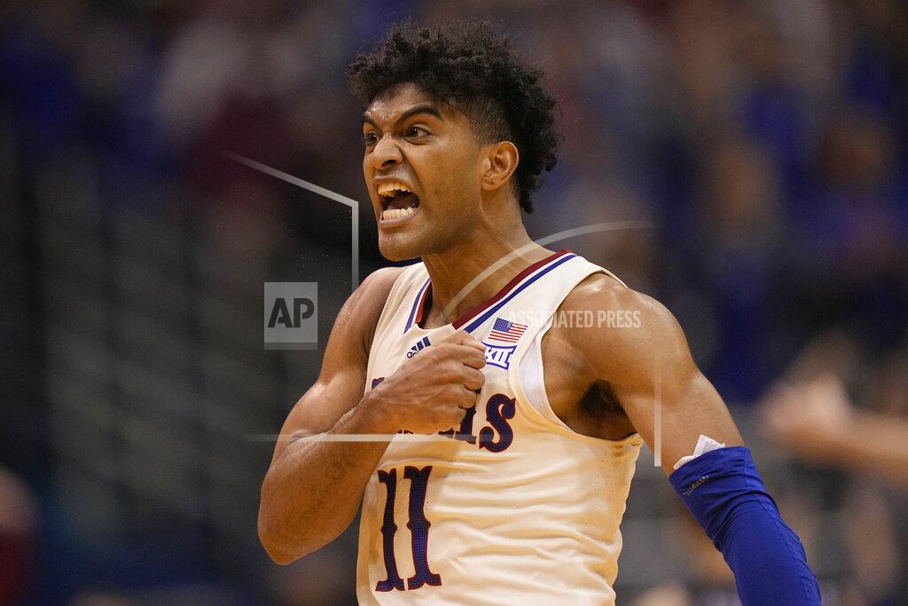 Charlie Riedel Kansas' Remy Martin celebrates after making a basket during the second half of an NCAA college basketball game against Stephen F. Austin Saturday, Dec. 18, 2021, in Lawrence, Kan. (AP Photo/Charlie Riedel)