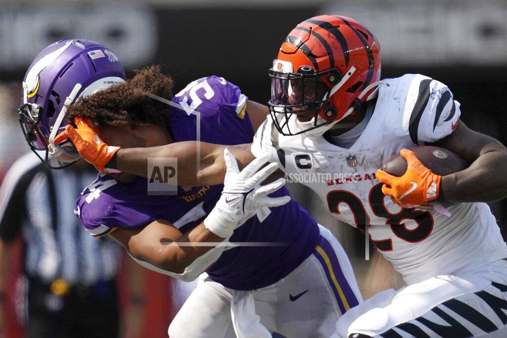 Anthony Souffle Cincinnati Bengals running back Joe Mixon (28) knocks the helmet off Minnesota Vikings middle linebacker Eric Kendricks (54) as he rushes the ball in the fourth quarter of an NFL football game Sunday, Sept. 12, 2021, in Cincinnati. (Andrew Souffle/Star Tribune via AP)