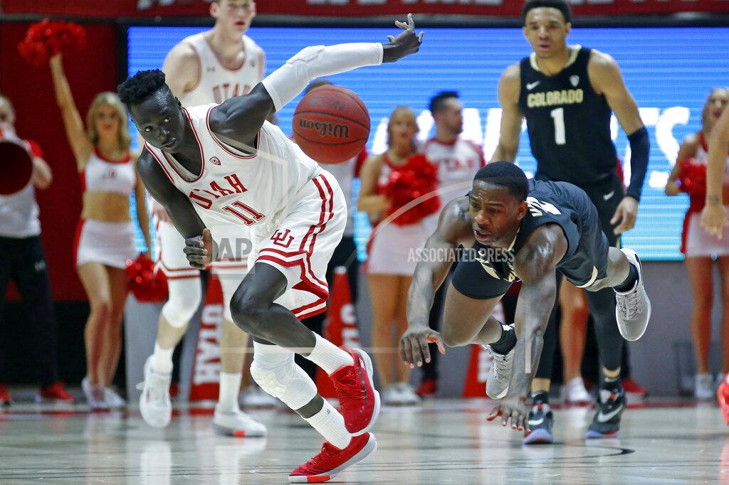 Rick Bowmer Utah guard Both Gach (11) and Colorado guard McKinley Wright IV, right, go after a loose ball in the second half during an NCAA college basketball game Saturday, March 7, 2020, in Salt Lake City. (AP Photo/Rick Bowmer)