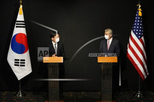 U.S. Special Representative for North Korea, Sung Kim, right, and South Korea's Special Representative for Korean Peninsula Peace and Security Affairs Noh Kyu-duk attend a briefing after their meeting at a hotel in Seoul, South Korea, Sunday, Oct. 24, 2021. (AP Photo/Ahn Young-joon, Pool)