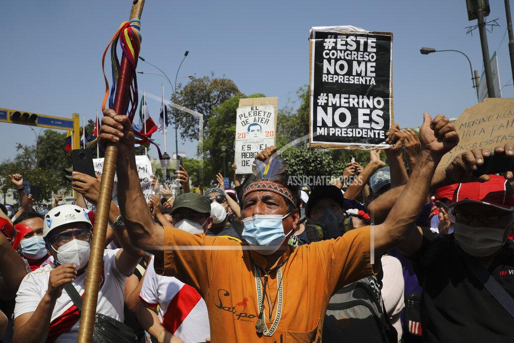 Rodrigo Abd Protesters celebrate the resignation of interim president Manuel Merino in Lima, Peru, Sunday, Nov. 15, 2020. Merino stepped down Sunday after two people were killed the night before during a wave of protests unleashed when Congress ousted President Martin Vizcarra. (AP Photo/Rodrigo Abd)