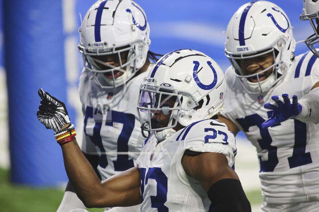 Tony Ding Indianapolis Colts cornerback Kenny Moore II (23) celebrates his 29-yard interception return for a touchdown with his teammates during the second half of an NFL football game, Sunday, Nov. 1, 2020, in Detroit. (AP Photo/Tony Ding)