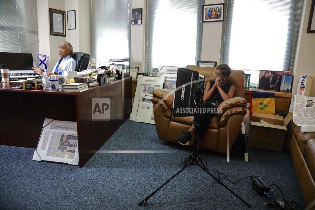 Bebeto Matthews The Rev. Al Sharpton, sits during an interview at his office, with his long-time publicist Rachel Noerdlinger, right, seated nearby, Thursday, July 30, 2020, in New York. For more than three decades, Sharpton, 65, has been a go-to advocate for Black American families seeking justice and peace in the wake of violence and countless incidents that highlight systemic racism. (AP Photo/Bebeto Matthews)