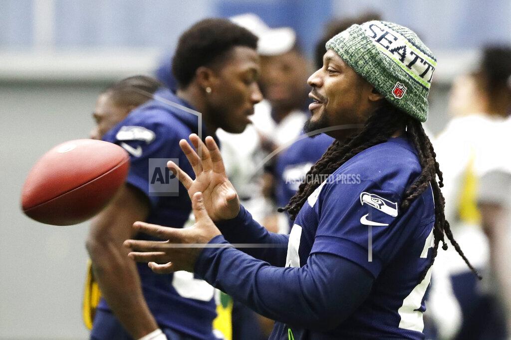 Ted S. Warren Seattle Seahawks running back Marshawn Lynch catches a football as he warms up for NFL football practice, Friday, Dec. 27, 2019, in Renton, Wash. The Seahawks will face the San Francisco 49ers Sunday, Dec. 29, 2019 in Seattle. (AP Photo/Ted S. Warren)