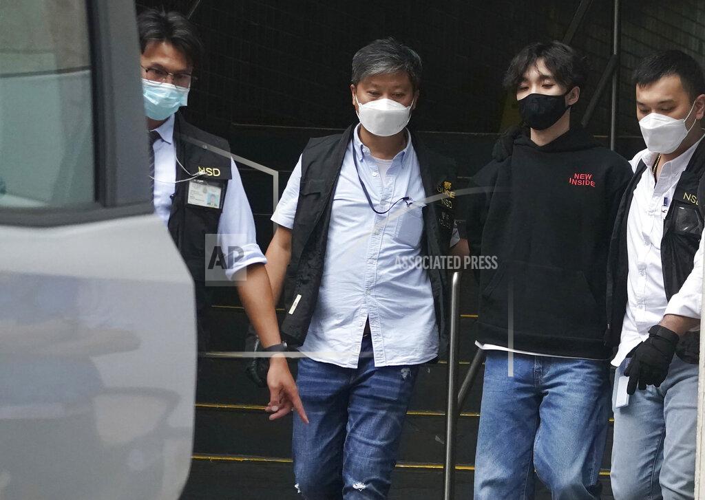 Uncredited Wong Yat-chin, second from right, leader of Hong Kong Student Politicism escorted after being arrested by national security police in Hong Kong, Monday, Sept. 20, 2021. Hong Kong national security police on Monday arrested at least two members of the Hong Kong Student Politicism, including Wong and and secretary Chan Chi-sum, amid a sweeping crackdown on dissent in the semi-autonomous Chinese city. (AP Photo)