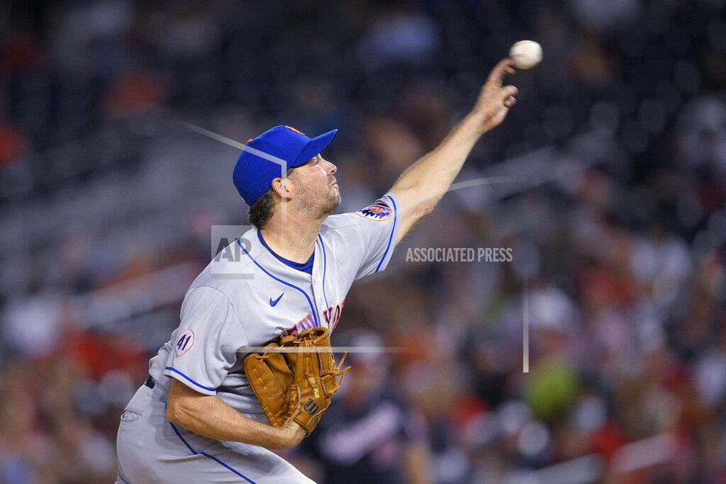 Nick Wass New York Mets starter Rich Hill delivers a pitch during the third inning of the team's baseball game against the Washington Nationals, Friday, Sept. 3, 2021, in Washington. (AP Photo/Nick Wass)