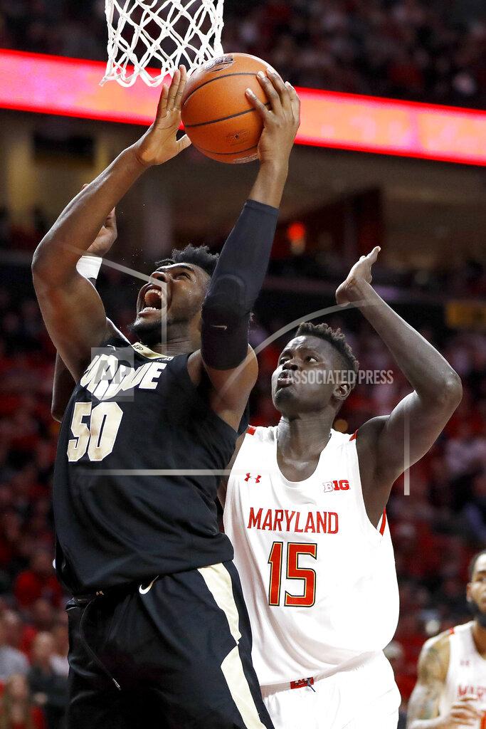 Julio Cortez Purdue forward Trevion Williams (50) goes up for a shot against Maryland center Chol Marial (15) during the first half of an NCAA college basketball game, Saturday, Jan. 18, 2020, in College Park, Md. (AP Photo/Julio Cortez)