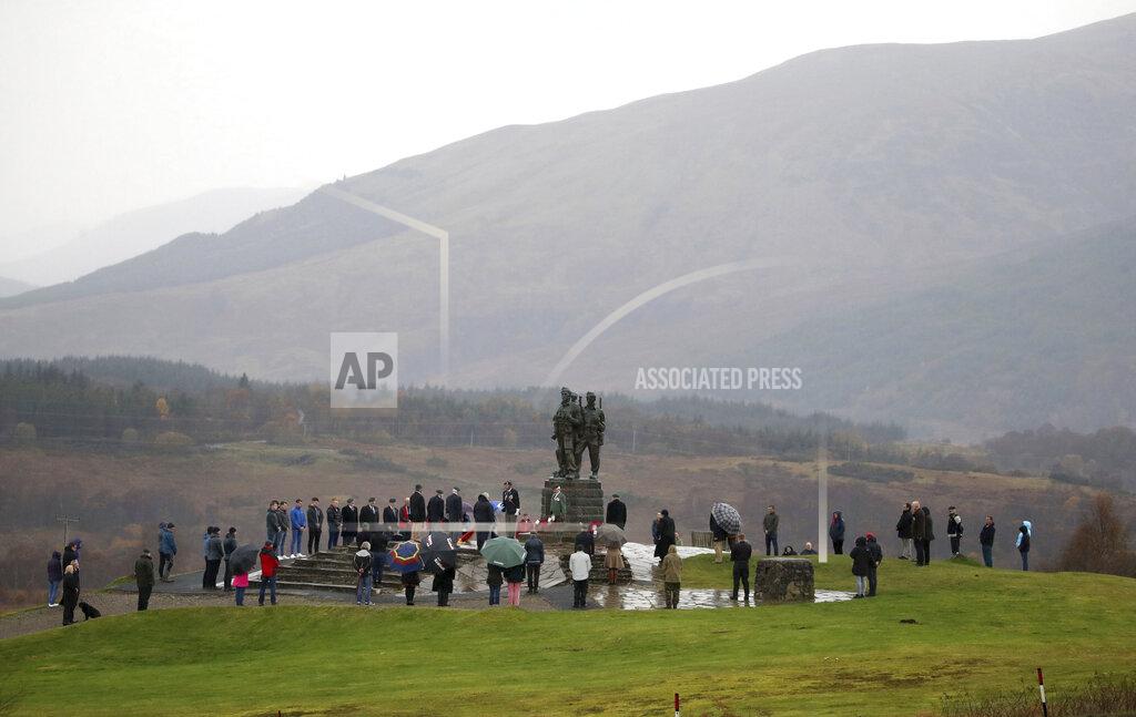 Andrew Milligan A small number of serving and former Royal Marine Commandos gather, at the Commando Memorial for the annual Remembrance Sunday ceremony, at Spean Bridge, near Fort William, Scotland, Sunday, Nov. 8, 2020. (Andrew Milligan/PA via AP)
