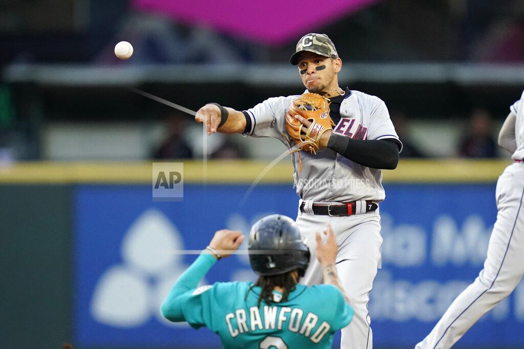 Elaine Thompson Cleveland Indians second baseman Cesar Hernandez throws to first base after forcing out Seattle Mariners' J.P. Crawford (3) at second base during the second inning of a baseball game Friday, May 14, 2021, in Seattle. Dylan Moore was out at first on the double play. (AP Photo/Elaine Thompson)