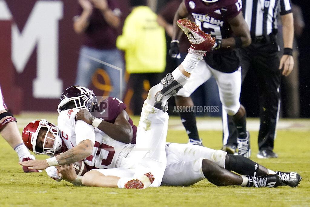 Sam Craft Texas A&M defensive lineman Tyree Johnson (3) sacks Arkansas quarterback Feleipe Franks (13) for a loss during the second quarter of an NCAA college football game Saturday, Oct. 31, 2020, in College Station, Texas. (AP Photo/Sam Craft)