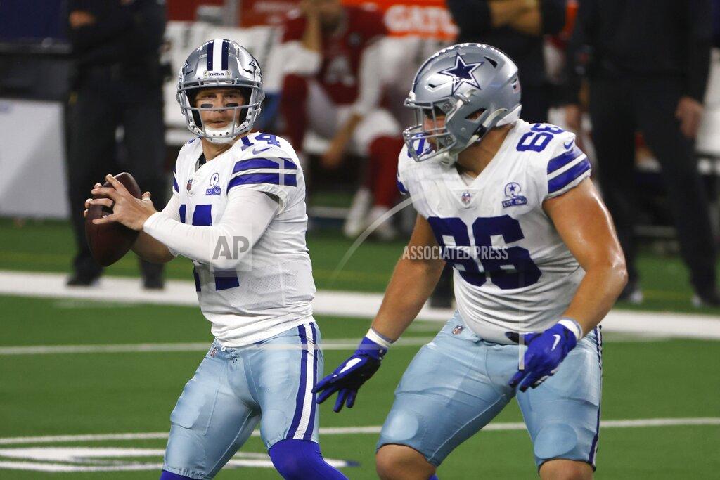Ron Jenkins Dallas Cowboys quarterback Andy Dalton (14) drops back to pass under protection from guard Connor McGovern (66) in the first half of an NFL football game against the Arizona Cardinals in Arlington, Texas, Monday, Oct. 19, 2020. (AP Photo/Ron Jenkins)