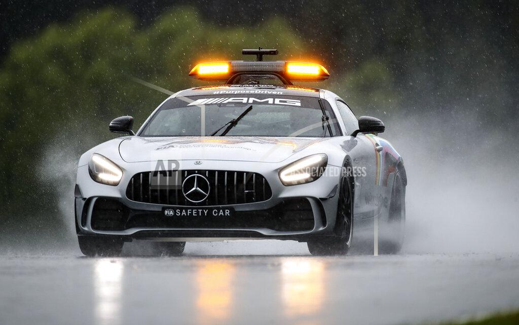 Mark Thompson The safety car drives through the rain prior to the qualifying for the Styrian Formula One Grand Prix at the Red Bull Ring racetrack in Spielberg, Austria, Saturday, July 11, 2020. The Styrian F1 Grand Prix will be held on Sunday. (Mark Thompson/Pool via AP)