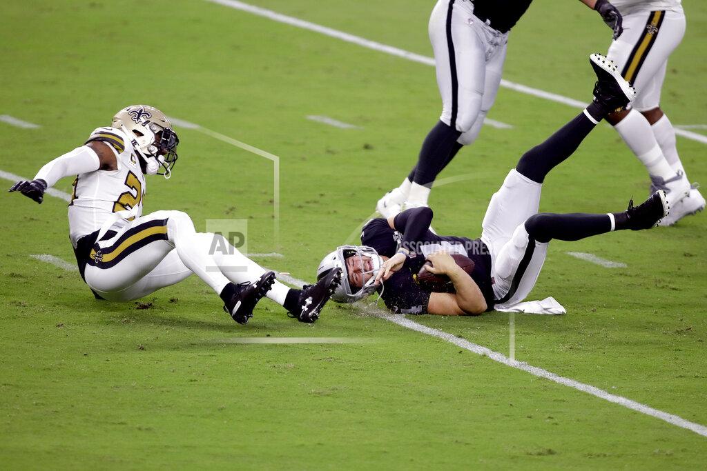 Isaac Brekken New Orleans Saints strong safety Malcolm Jenkins, left, sacks Las Vegas Raiders quarterback Derek Carr (4) during the first half of an NFL football game, Monday, Sept. 21, 2020, in Las Vegas. (AP Photo/Isaac Brekken)