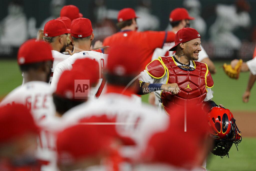 Jeff Roberson St. Louis Cardinals catcher Yadier Molina, right, celebrates a 5-4 victory over the Pittsburgh Pirates in a baseball game Friday, July 24, 2020, in St. Louis. (AP Photo/Jeff Roberson)