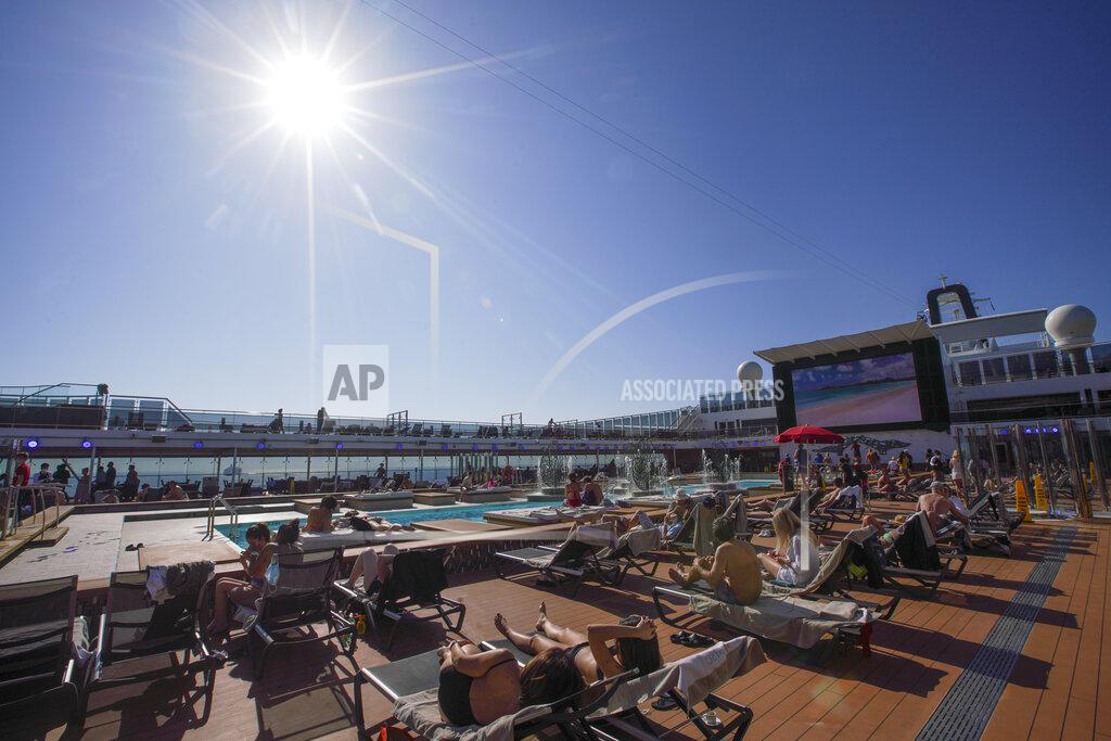 Andrew Medichini Passengers enjoy the sun by a swimming pool on board the MSC Grandiosa cruise ship in Civitavecchia, near Rome, Wednesday, March 31, 2021. MSC Grandiosa, the world's only cruise ship to be operating at the moment, left from Genoa on March 30 and stopped in Civitavecchia near Rome to pick up more passengers and then sail toward Naples, Cagliari, and Malta to be back in Genoa on April 6. For most of the winter, the MSC Grandiosa has been a lonely flag-bearer of the global cruise industry stalled by the pandemic, plying the Mediterranean Sea with seven-night cruises along Italy’s western coast, its major islands and a stop in Malta. (AP Photo/Andrew Medichini)