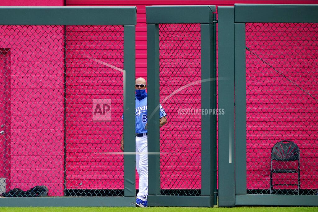 Charlie Riedel Kansas City Royals bullpen catcher closes the bullpen gate during the third inning of a baseball game against the Chicago White Sox Sunday, Aug. 2, 2020, in Kansas City, Mo. (AP Photo/Charlie Riedel)