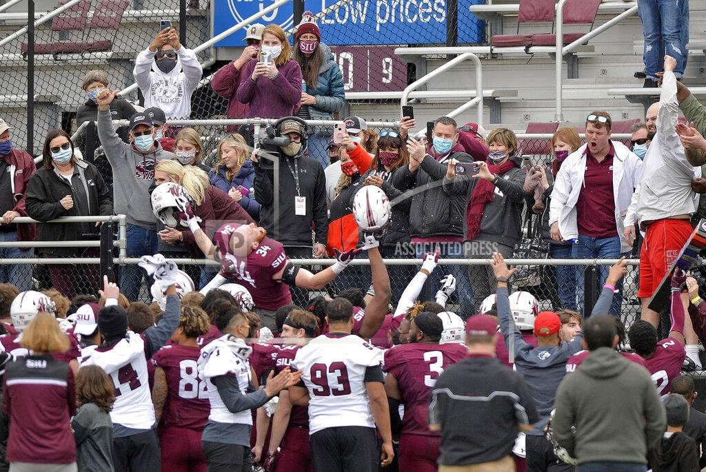 Byron Hetzler Southern Illinois linebacker Luke Giegling (34) and teammates celebrate in front of fans after a 38-14 win over North Dakota State in an NCAA college football game Saturday, Feb. 29, 2021, in Carbondale, Ill. (Byron Hetzler/The Southern Illinoisan via AP)