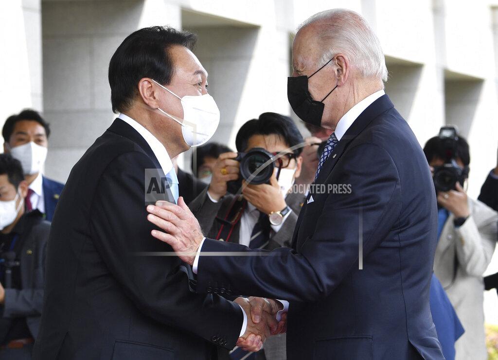 Song Kyung-Seok South Korean President Yoon Suk Yeol, left, greets U.S. President Joe Biden prior to their summit meeting at the People's House Saturday, May 21, 2022, in Seoul, South Korea. (Song Kyung-Seok/Pool Photo via AP)