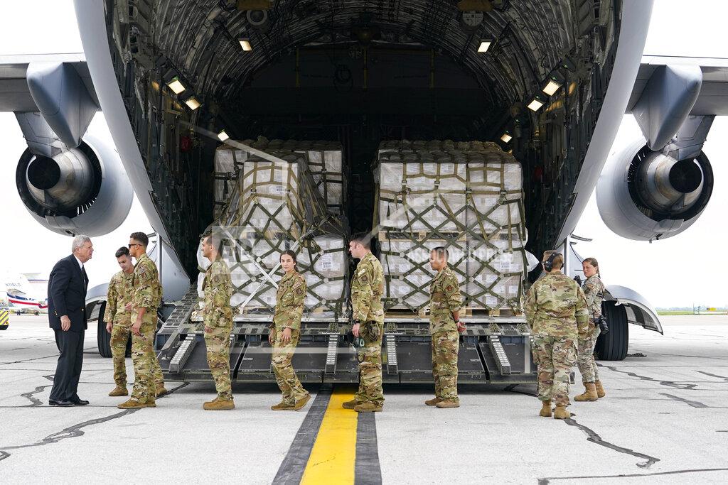 Michael Conroy Agriculture Secretary Tom Vilsack, left, greets crew members of a C-17 that delivered a plane load of baby formula at the Indianapolis International Airport in Indianapolis, Sunday, May 22, 2022. The 132 pallets of Nestlé Health Science Alfamino Infant and Alfamino Junior formula arrived from Ramstein Air Base in Germany (AP Photo/Michael Conroy)
