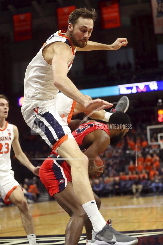 Andrew Shurtleff Virginia forward Jay Huff leaps over Stony Brook guard Andrew Garcia (23) during an NCAA college basketball game in Charlottesville, Va., Wednesday, Dec. 18, 2019. (AP Photo/Andrew Shurtleff)