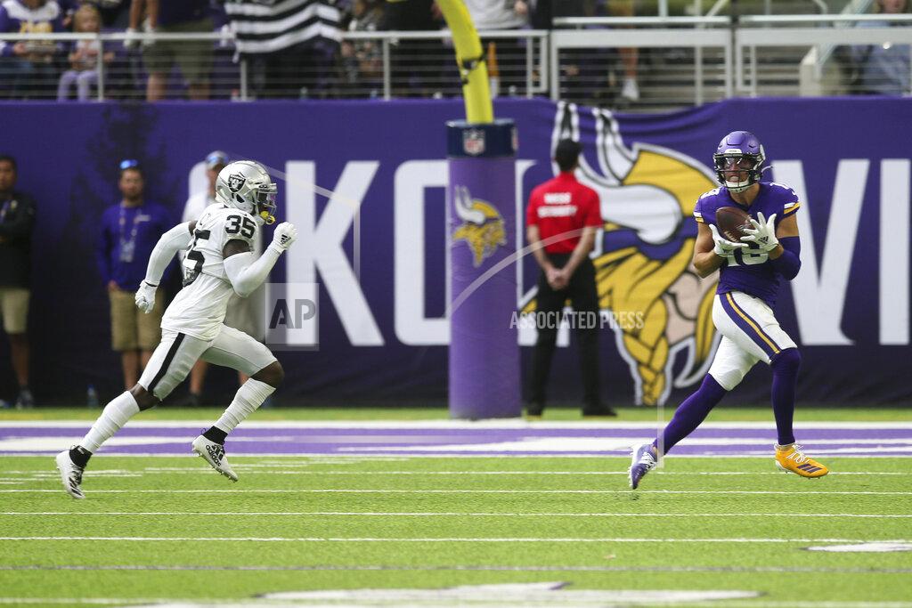 Jim Mone Minnesota Vikings wide receiver Adam Thielen catches a 35-yard touchdown pass ahead of Oakland Raiders free safety Curtis Riley, left, during the first half of an NFL football game, Sunday, Sept. 22, 2019, in Minneapolis. (AP Photo/Jim Mone)