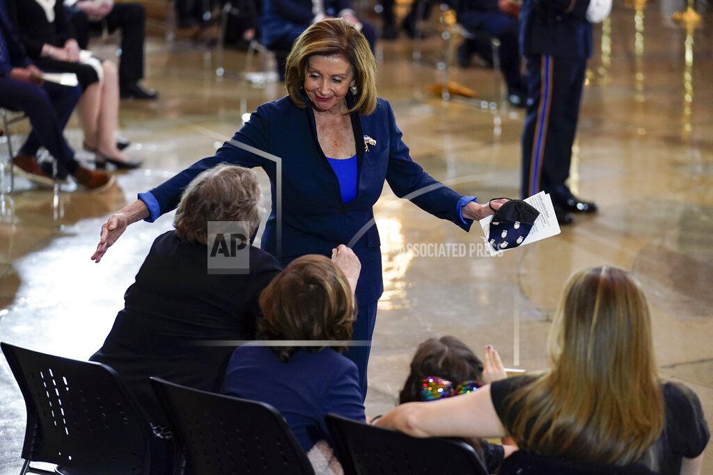 J. Scott Applewhite House Speaker Nancy Pelosi of Calif., greets the family of slain U.S. Capitol Police officer William "Billy" Evans, including Janice Evans, from left, Logan Evans, Abigail Evans, and Shannon Terranova, during a ceremony in the Rotunda at the Capitol in Washington, Tuesday, April 13, 2021. (AP Photo/J. Scott Applewhite, Pool)