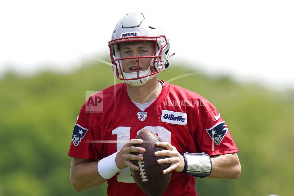 Steven Senne New England Patriots quarterback Mac Jones takes part in drills at the NFL football team's practice facility in Foxborough, Mass., Monday, May 23, 2022. (AP Photo/Steven Senne)