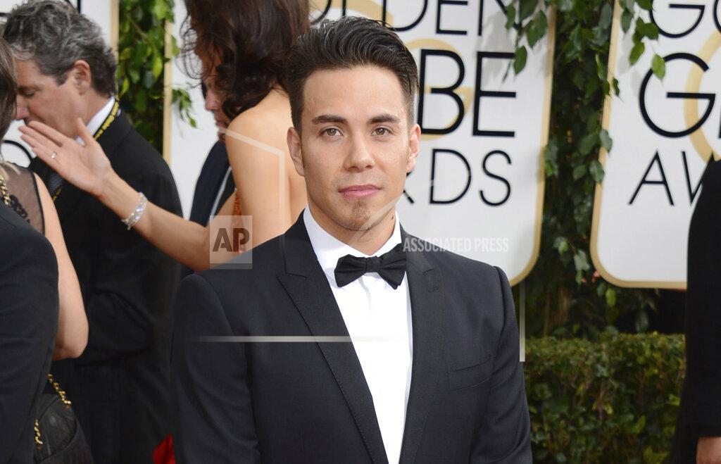Jordan Strauss FILE - Apolo Ohno arrives at the 71st annual Golden Globe Awards on Jan. 12, 2014, in Beverly Hills, Calif. Olympians including Michael Phelps, Ohno and Jeremy Bloom are opening up about their mental health struggles in a new sobering documentary about suicide and depression among the world's greatest athletes. Many of the athletes are sharing their pain for the first time in HBO's "The Weight of Gold," which aims to expose the problem, incite change among Olympics leadership and help others experiencing similar issues feel less alone. (Photo by Jordan Strauss/Invision/AP, File)