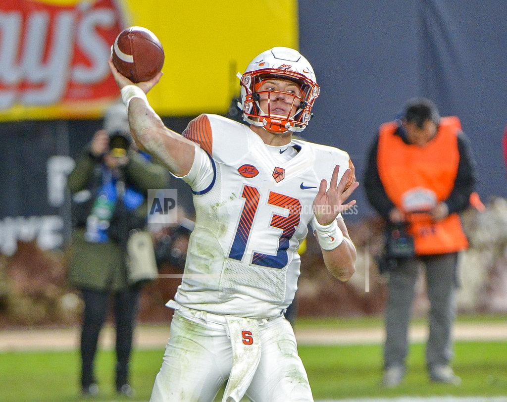 Howard Simmons Syracuse quarterback Tommy DeVito (13) throws a pass during an NCAA college football game against Notre Dame, Saturday, Nov. 17, 2018, at Yankee Stadium in New York. (AP Photo/Howard Simmons)