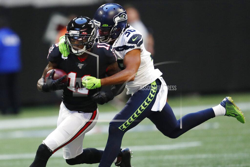 John Bazemore Seattle Seahawks cornerback Akeem King (36) tackles Atlanta Falcons wide receiver Julio Jones (11) during the second half of an NFL football game, Sunday, Oct. 27, 2019, in Atlanta. (AP Photo/John Bazemore)