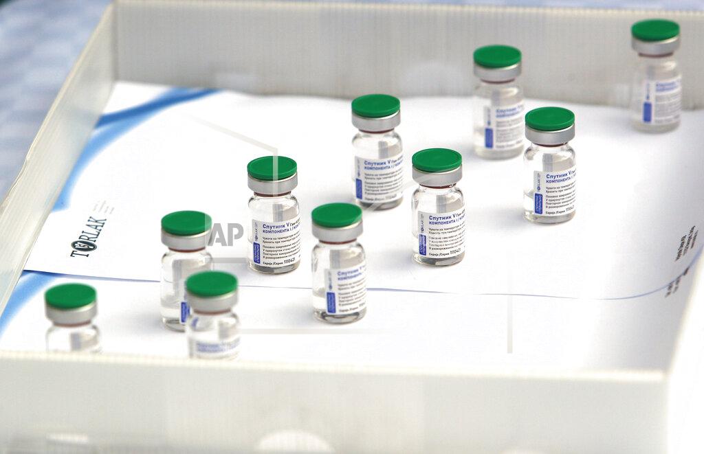 Darko Vojinovic Vials of the Sputnik V vaccine placed on a table prior to the visit of Serbian President Aleksandar Vucic in Belgrade, Serbia, Thursday, April 15, 2021. Serbia has announced it will begin packing and later producing Russia's Sputnik V coronavirus vaccine, which would make it the first European state outside Russia and Belarus to begin manufacturing the jab. (AP Photo/Darko Vojinovic)
