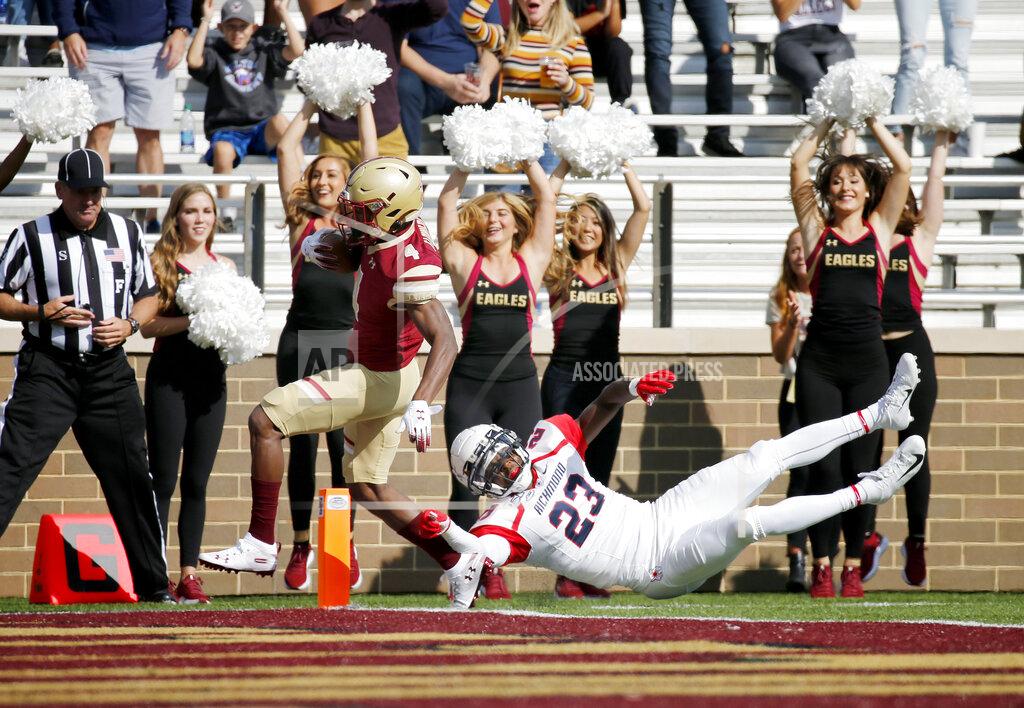 Mary Schwalm Boston College wide receiver Zay Flowers (4) rushes into the end zone ahead of Richmond defensive back Daniel Jones (23) during the first half of an NCAA college football game, Saturday, Sept. 7, 2019, in Boston. (AP Photo/Mary Schwalm)