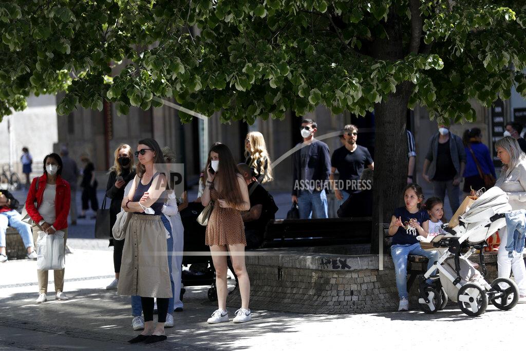 Petr David Josek People wait in line in front of a shop in Prague, Czech Republic, Monday, May 10, 2021. The Czech Republic is massively relaxing its coronavirus restrictions as the hard-hit nation pay respect to nearly 30,000 dead. Monday's wave of easing came after the new infections fell to the levels unseen from August when the government failed to react in time to an opposite trend, the growing numbers of infected which later contributed to record numbers of deaths. (AP Photo/Petr David Josek)