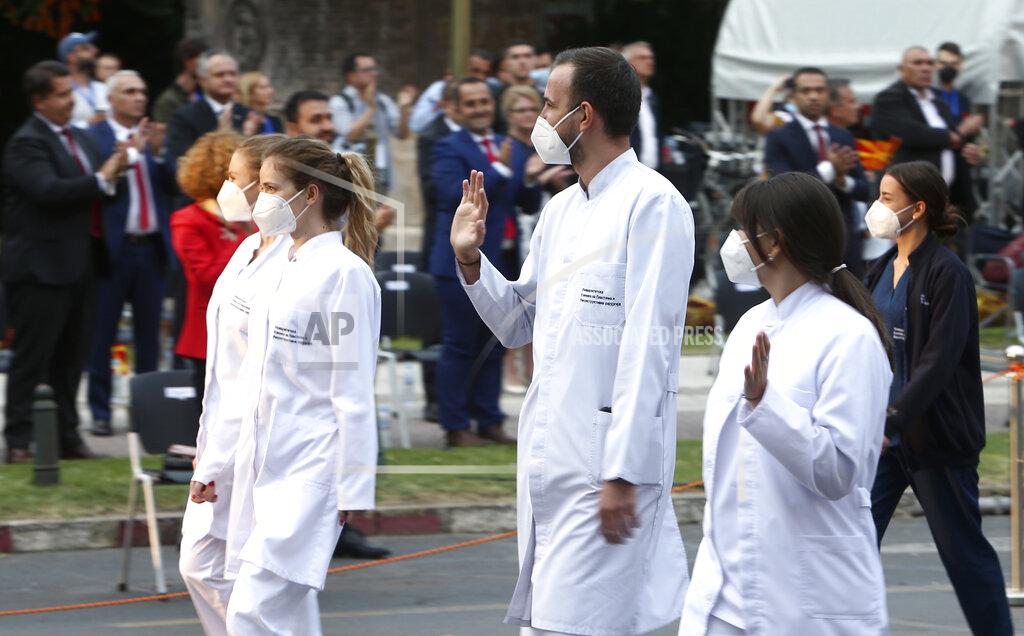 Boris Grdanoski Health workers are greeted as they take part in a parade to mark the Independence Day in downtown Skopje, North Macedonia, Wednesday, Sept. 8, 2021. North Macedonia is celebrating Wednesday the 30th anniversary since its independence from former Yugoslavia. (AP Photo/Boris Grdanoski)