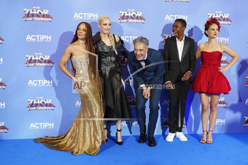 Scott Garfitt Tessa Thompson, from left, Pom Klementieff, director Taika Waititi, Kieron L. Dyer and Natalie Portman pose for photographers upon arrival at the screening of the film 'Thor: Love and Thunder in London Tuesday, July 5, 2022. (AP Photo/Scott Garfitt)