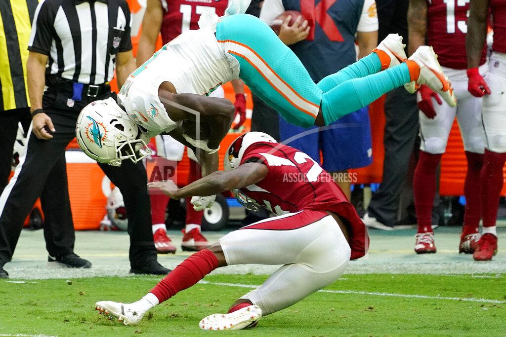 Rick Scuteri Miami Dolphins wide receiver DeVante Parker is upended by Arizona Cardinals cornerback De'Vante Bausby, right, during the first half of an NFL football game, Sunday, Nov. 8, 2020, in Glendale, Ariz. (AP Photo/Rick Scuteri)