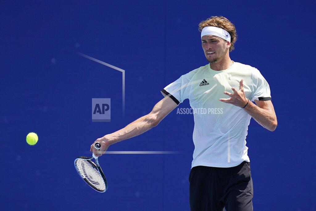 Alexander Zverev, of Germany, returns to Taiwan's Lu Yen-Hsun during the tennis competition at the 2020 Summer Olympics, Sunday, July 25, 2021, in Tokyo, Japan. (AP Photo/Patrick Semansky)