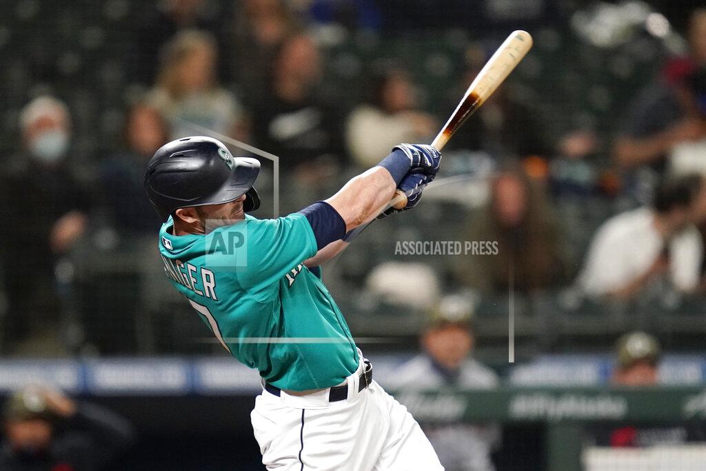 Elaine Thompson Seattle Mariners' Mitch Haniger hits a two-run home run against the Cleveland Indians during the seventh inning of a baseball game Friday, May 14, 2021, in Seattle. (AP Photo/Elaine Thompson)