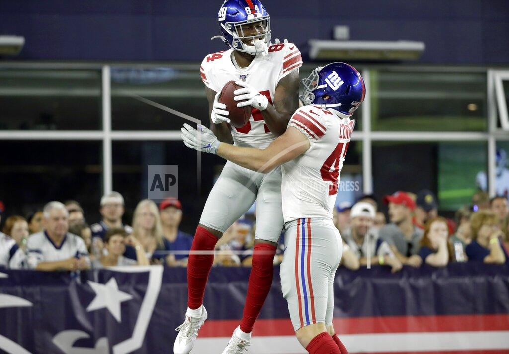 Elise Amendola New York Giants wide receiver Alonzo Russell, left, celebrates his touchdown catch with C.J. Conrad in the first half of an NFL preseason football game against the New England Patriots, Thursday, Aug. 29, 2019, in Foxborough, Mass. (AP Photo/Elise Amendola)
