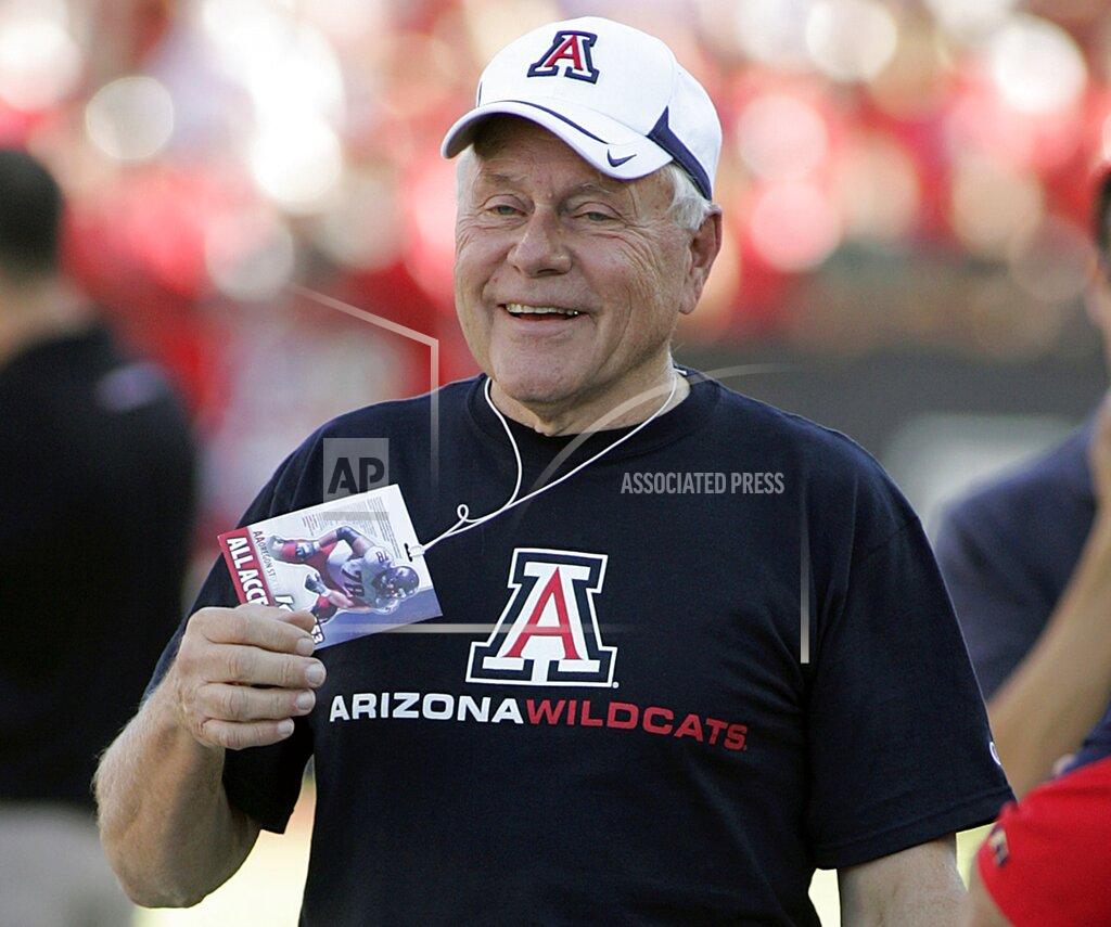 John Miller FILE - In this Oct. 9, 2010, file photo, former Arizona football head coach Dick Tomey, is seen back in Arizona Stadium for the 1st time since 2000, jokes on the sidelines before the NCAA college football game against Oregon State in Tucson, Ariz. Tomey, the winningest football coach in University of Arizona history, died Friday night, May 10, 2019, in Tucson, Ariz. He was 80. Tomey was 183-145-7 overall in 20 years as head coach at Hawaii, Arizona and San Jose State. He was diagnosed with lung cancer in December. (AP Photo/John Miller, File)